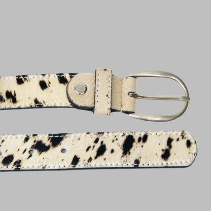 Cow print leather cuff, belt and bag