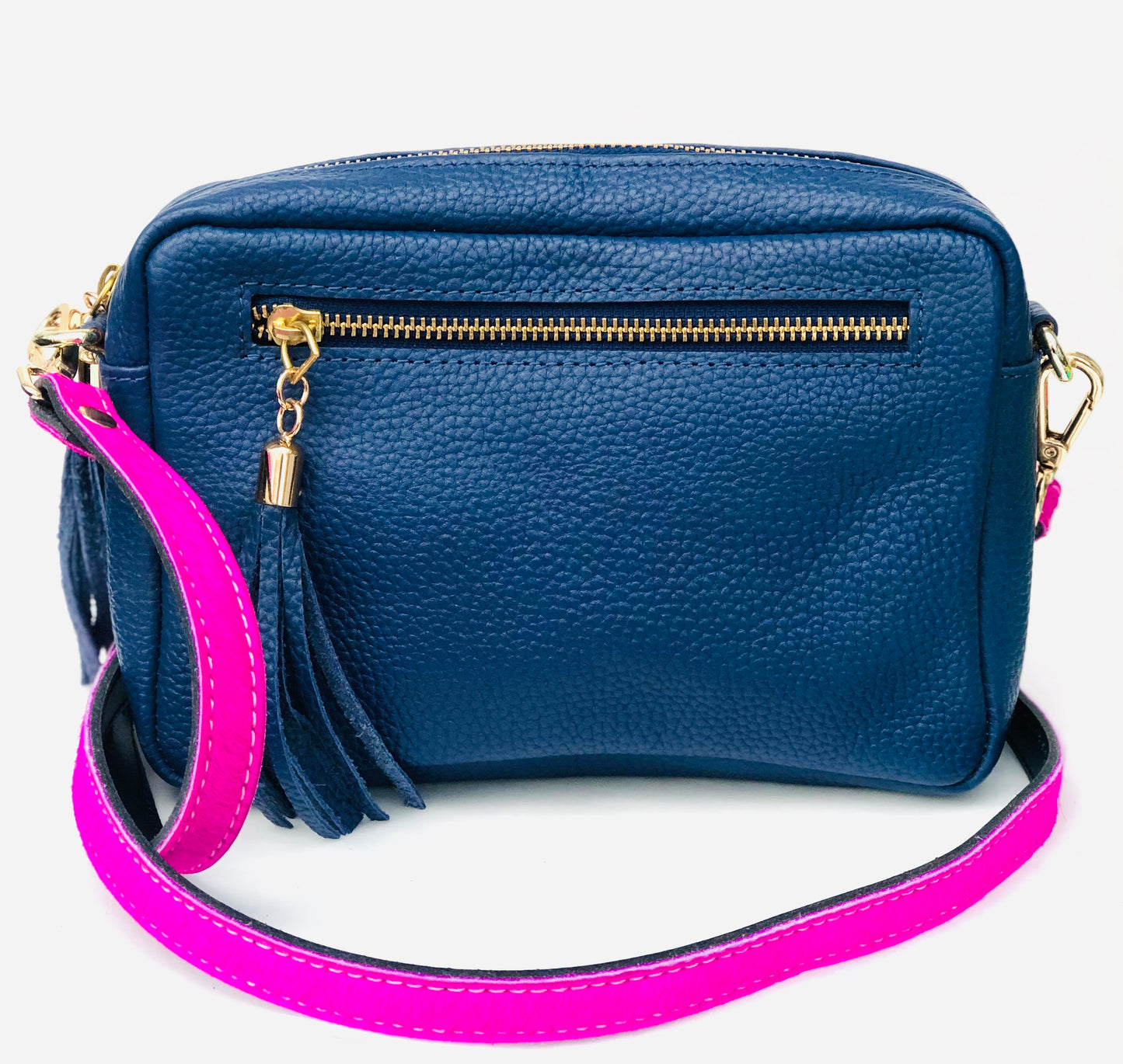 back side of blue leather bag with neon pink leather straps