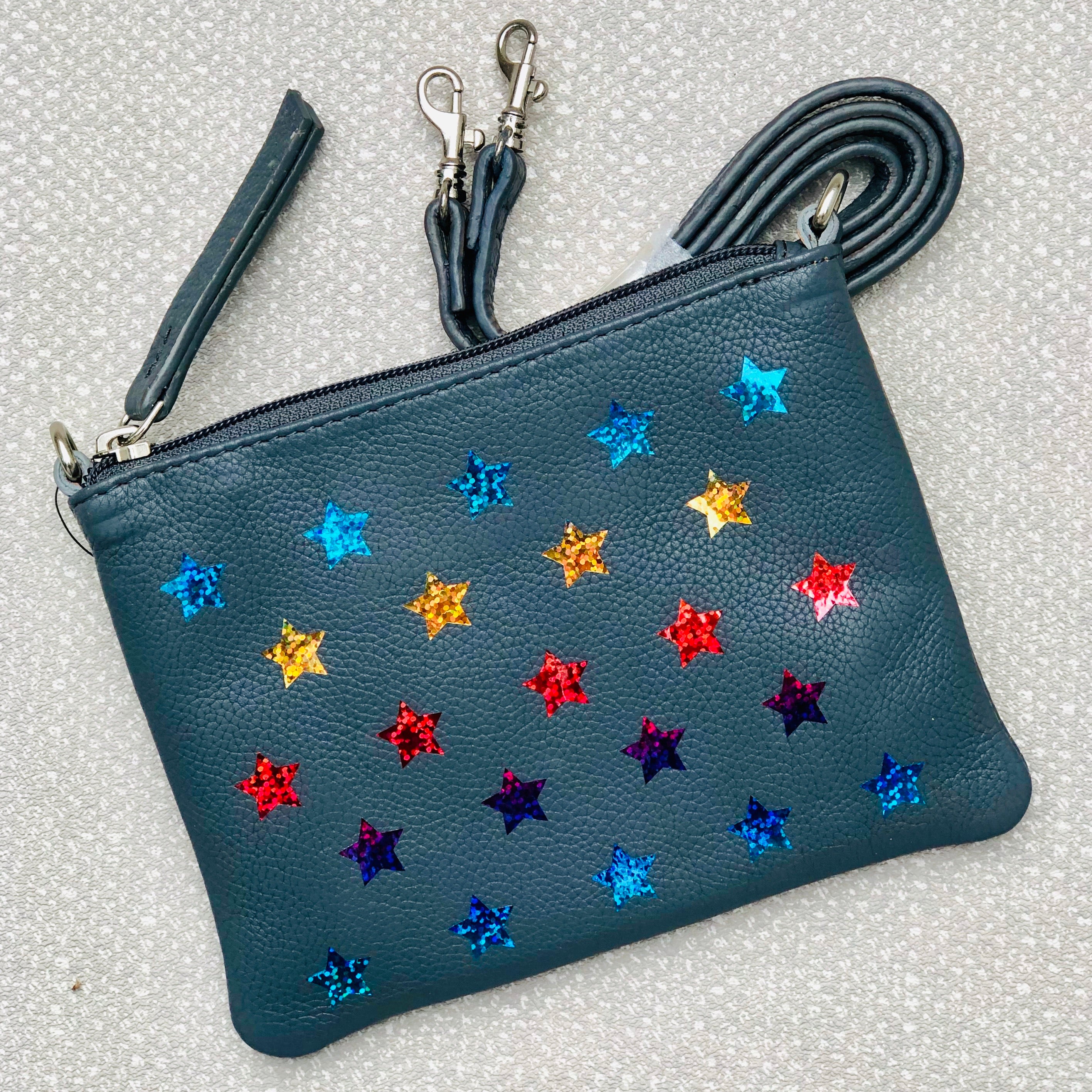 Small clutch bag deals with shoulder strap