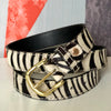 Zebra hair-on-hide leather women belt with orange, white and gray background
